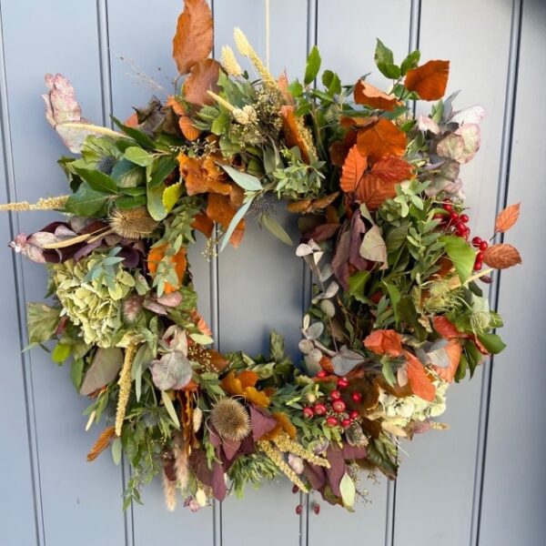 Autumn wreath of fresh and dried flowers