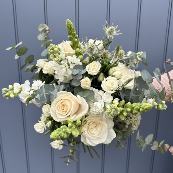 White flowers in a bouquet called ivory florals