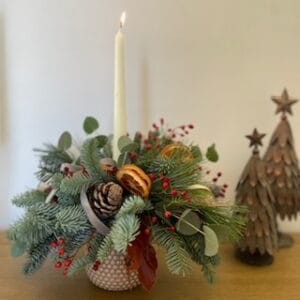 Table display and lit whit e tapered candle