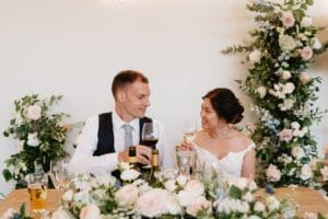 Bride and Groom celebrating at the top table after their marriae