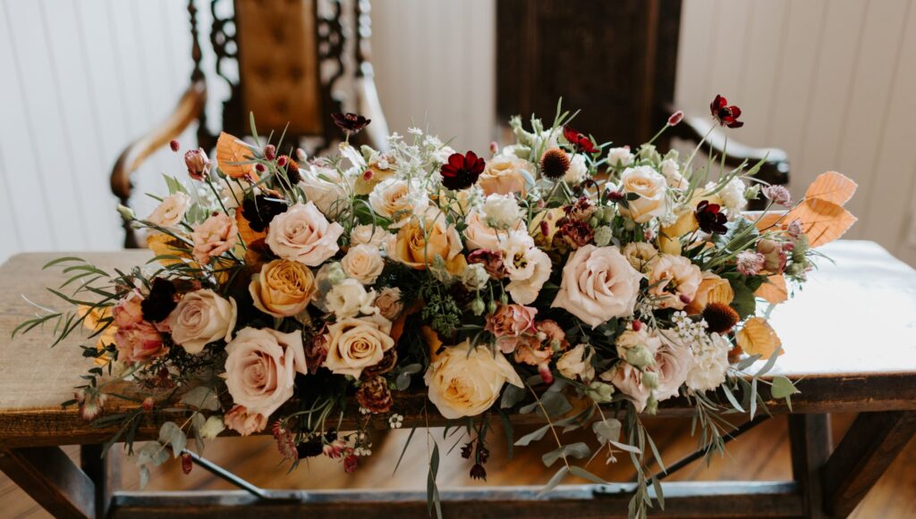 Autumnal ceremony table floral display