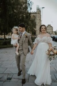 Bride and groom walking through central Bath after tying the knot