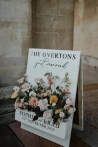 Floral A Board on street - welcome sign to a wedding
