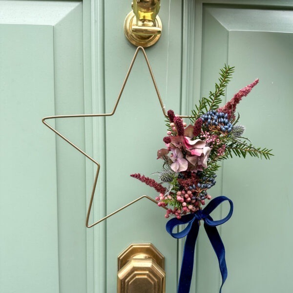 Simple golden star wreath with blue velvet ribbon