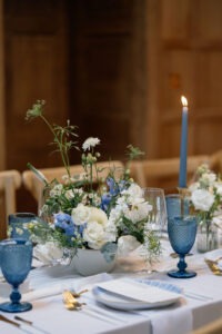 Compote bowl of flowers on reception table at wedding