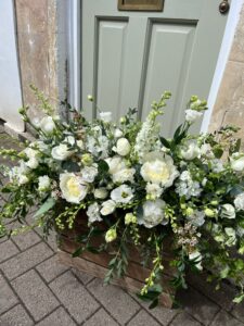 Seasonal white and green floral tribute