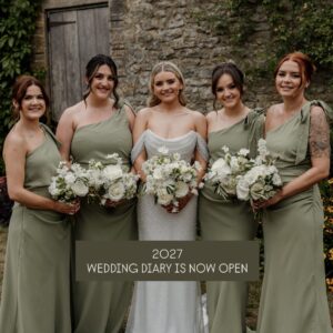 Bride and bridesmaids at Priston Mill in Bath holding bouquets